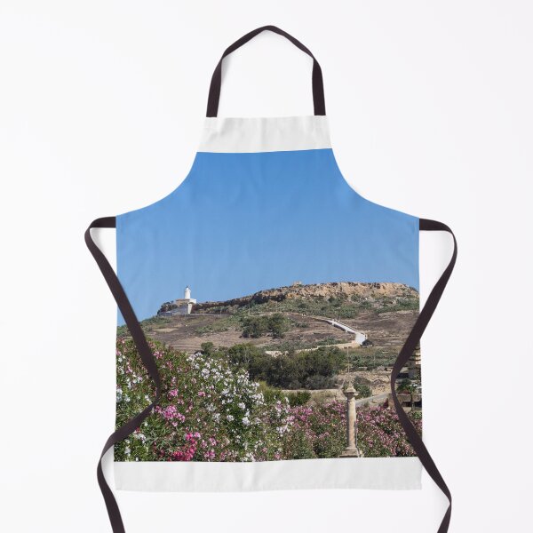 Item preview, White Lighthouse on Rocky Hill Overlooking Village and Pink Oleander Flowers Under Clear Blue Sky designed and sold by Nmallia.