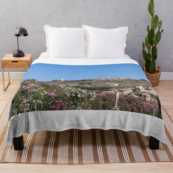 Item preview, White Lighthouse on Rocky Hill Overlooking Village and Pink Oleander Flowers Under Clear Blue Sky designed and sold by Nmallia.