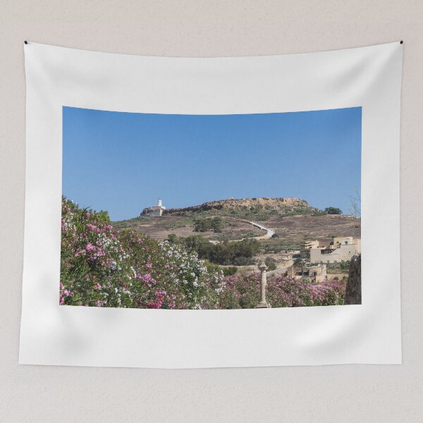 Item preview, White Lighthouse on Rocky Hill Overlooking Village and Pink Oleander Flowers Under Clear Blue Sky designed and sold by Nmallia.