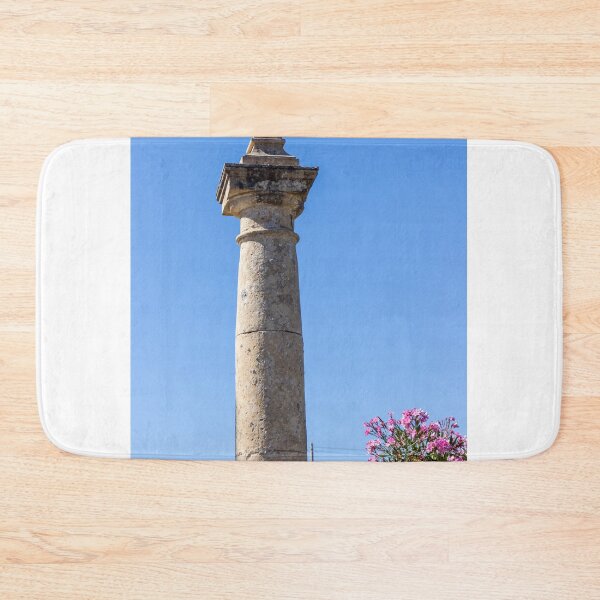 Item preview, Stone Cross on Historic Column Against Clear Blue Sky, Religious Monument Detail designed and sold by Nmallia.