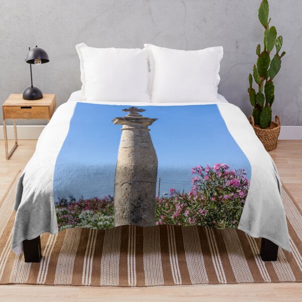 Item preview, Stone Cross on Historic Column Against Clear Blue Sky, Religious Monument Detail designed and sold by Nmallia.