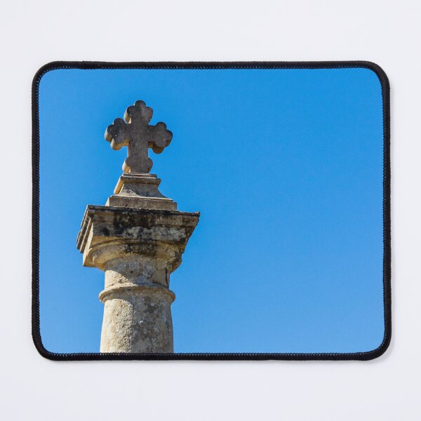 Item preview, Stone Cross on Historic Column Against Clear Blue Sky, Religious Monument Detail designed and sold by Nmallia.