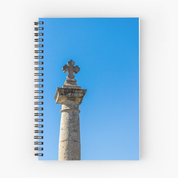 Item preview, Stone Cross on Historic Column Against Clear Blue Sky, Religious Monument Detail designed and sold by Nmallia.