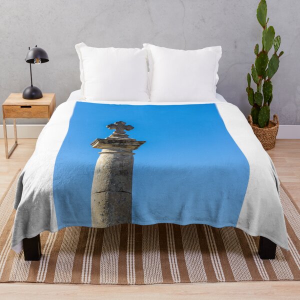 Item preview, Stone Cross on Historic Column Against Clear Blue Sky, Religious Monument Detail designed and sold by Nmallia.
