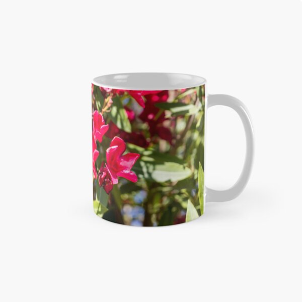 Item preview, Bright Red Oleander Flowers In Sunlit Garden With Green Leaves And Summer Bloom designed and sold by Nmallia.