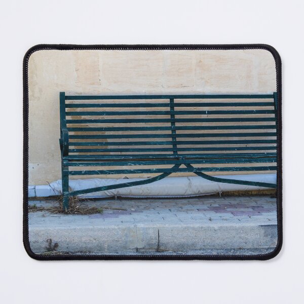 Item preview, Weathered Green Bench Against Aged Wall On Quiet Urban Sidewalk designed and sold by Nmallia.