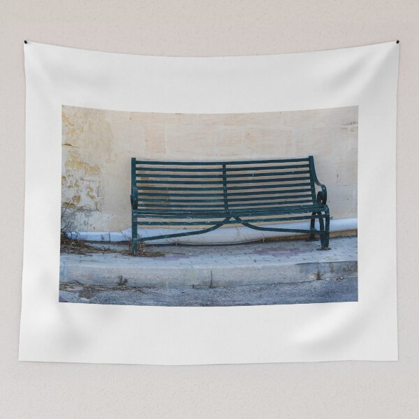 Item preview, Weathered Green Bench Against Aged Wall On Quiet Urban Sidewalk designed and sold by Nmallia.