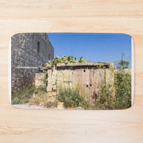 Item preview, Rusty Metal Door on Abandoned Stone Shed With Prickly Pear Cactus Under Clear Blue Sky designed and sold by Nmallia.