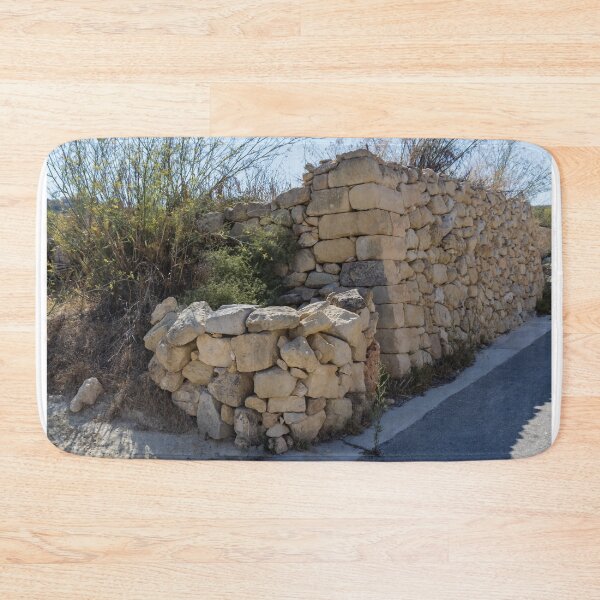 Item preview, Sunlit Dry Stone Wall Lining a Rustic Rural Country Road in Mediterranean Countryside designed and sold by Nmallia.
