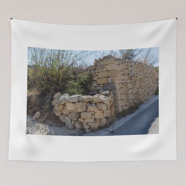 Item preview, Sunlit Dry Stone Wall Lining a Rustic Rural Country Road in Mediterranean Countryside designed and sold by Nmallia.