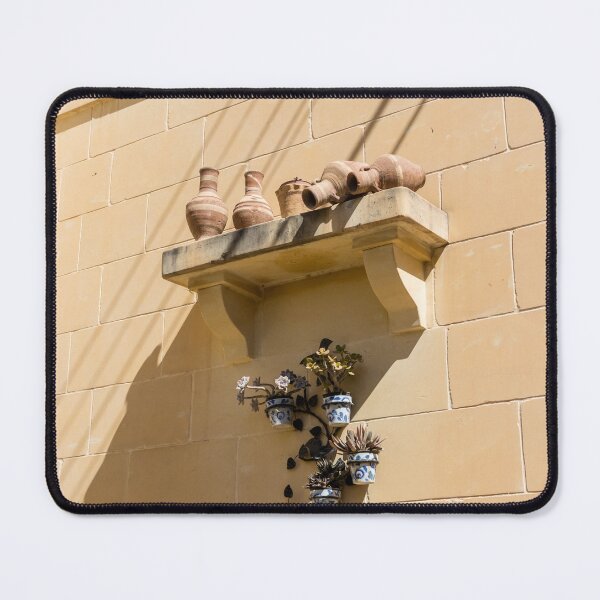 Item preview, Terracotta Pots And Blue Ceramic Planters On Sunlit Sandstone Wall With Deep Shadows designed and sold by Nmallia.