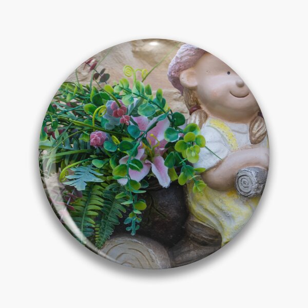 Item preview, Whimsical Garden Figurine Of Girl On Wooden Tricycle With Flowers Against Stone Wall designed and sold by Nmallia.