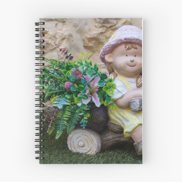Item preview, Whimsical Garden Figurine Of Girl On Wooden Tricycle With Flowers Against Stone Wall designed and sold by Nmallia.