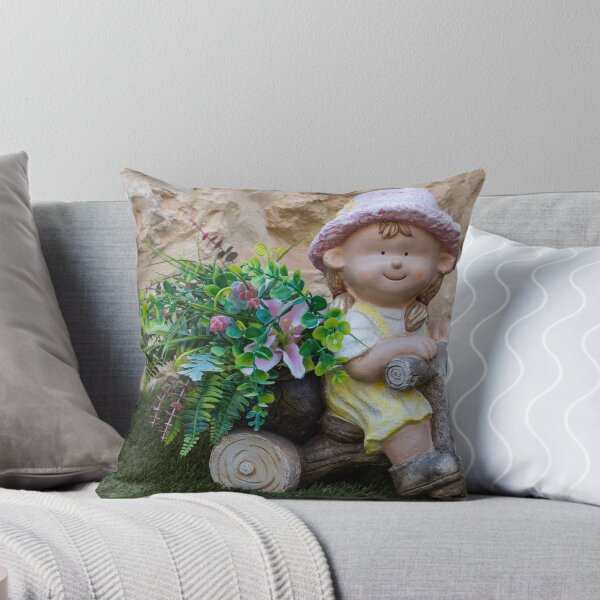 Item preview, Whimsical Garden Figurine Of Girl On Wooden Tricycle With Flowers Against Stone Wall designed and sold by Nmallia.