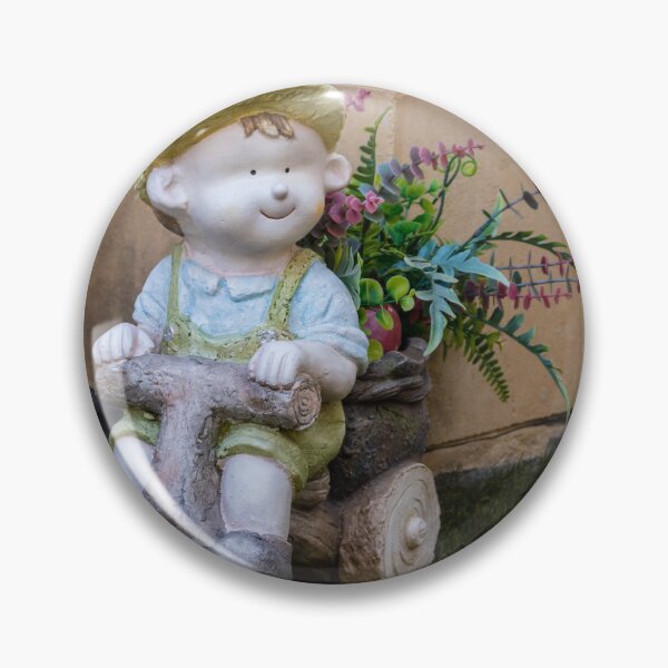 Item preview, Whimsical Garden Figurine Of Girl On Wooden Tricycle With Flowers Against Stone Wall designed and sold by Nmallia.