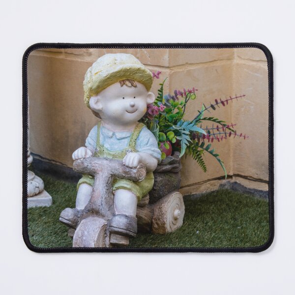 Item preview, Whimsical Garden Figurine Of Girl On Wooden Tricycle With Flowers Against Stone Wall designed and sold by Nmallia.