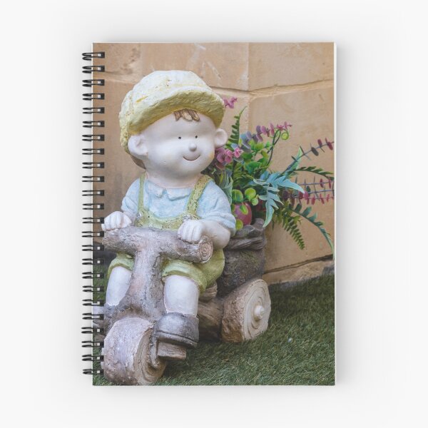 Item preview, Whimsical Garden Figurine Of Girl On Wooden Tricycle With Flowers Against Stone Wall designed and sold by Nmallia.