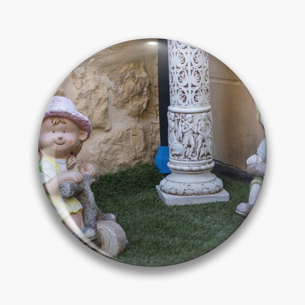 Item preview, Whimsical Garden Figurine Of Girl On Wooden Tricycle With Flowers Against Stone Wall designed and sold by Nmallia.