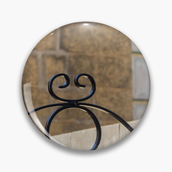 Item preview, Decorative Wrought Iron Gate With Scrollwork Against Stone Wall And Green Window designed and sold by Nmallia.