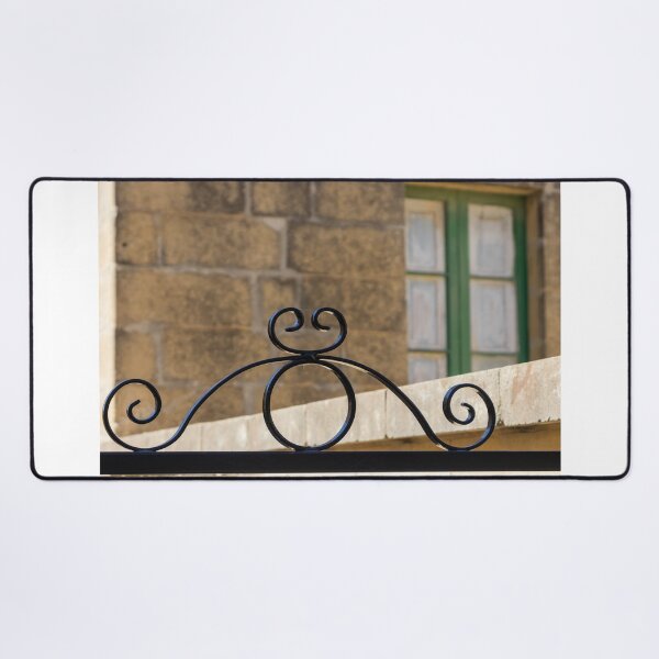Item preview, Decorative Wrought Iron Gate With Scrollwork Against Stone Wall And Green Window designed and sold by Nmallia.