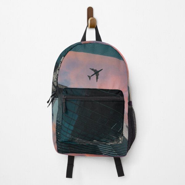 Item preview, Airplane over skyscrapers at a dramatic sunset designed and sold by Mauswohn.