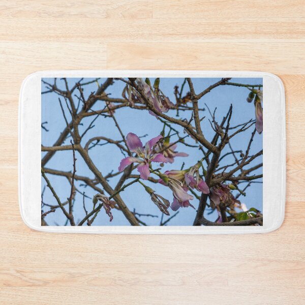 Item preview, Pink Blossoms on Bare Tree Branches Against Clear Blue Sky in Early Spring Morning designed and sold by Nmallia.