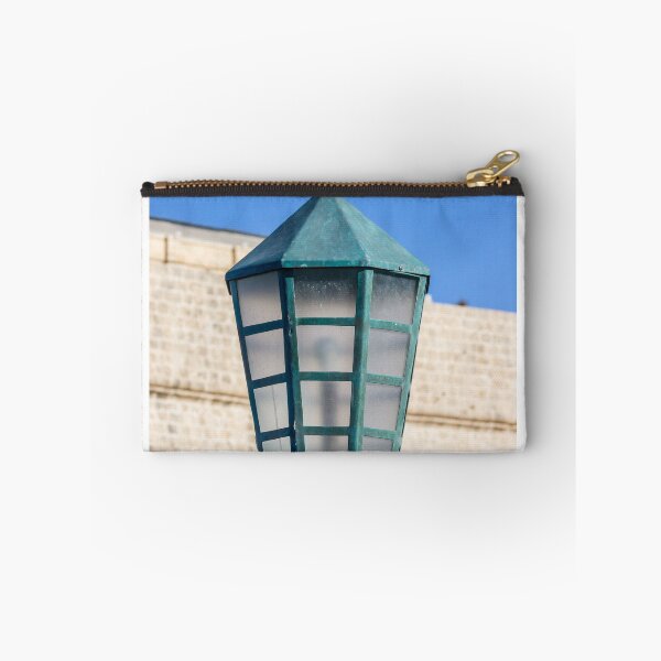Item preview, Vintage Green Street Lamp Lantern Against Blue Sky and Stone Wall Architectural Detail designed and sold by Nmallia.