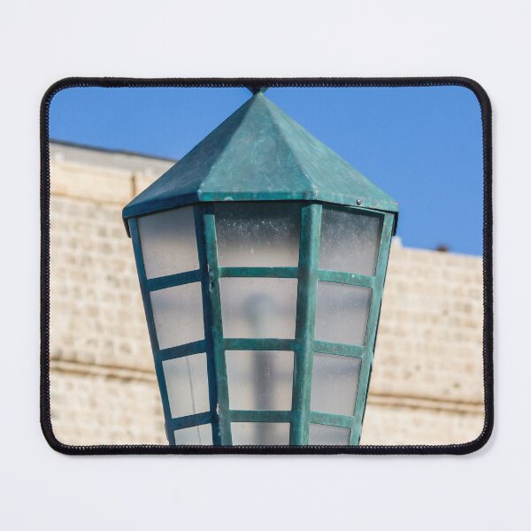 Item preview, Vintage Green Street Lamp Lantern Against Blue Sky and Stone Wall Architectural Detail designed and sold by Nmallia.