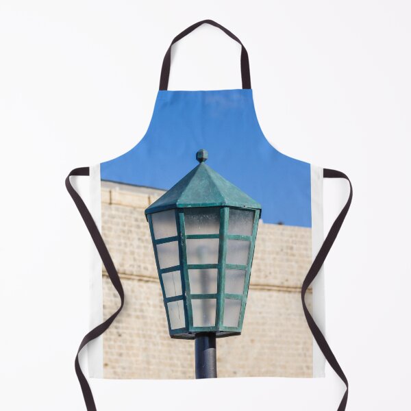 Item preview, Vintage Green Street Lamp Lantern Against Blue Sky and Stone Wall Architectural Detail designed and sold by Nmallia.