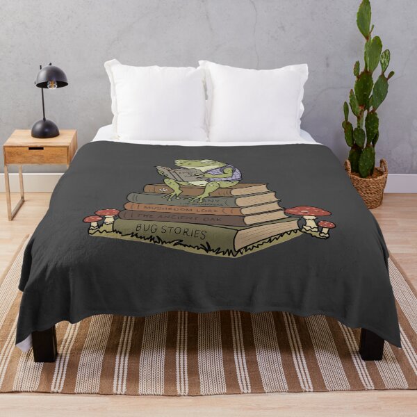Item preview, Frog reading on vintage book stack mushroom cottagecore illustration designed and sold by LeshanArt.