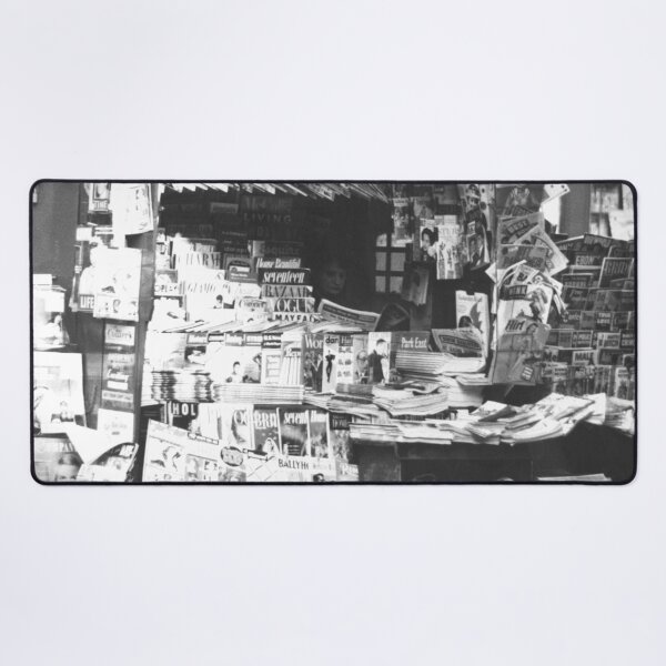Item preview, Woman reading inside a New York City newsstand black and white street life photograph designed and sold by Astrid Arkhangelsky.