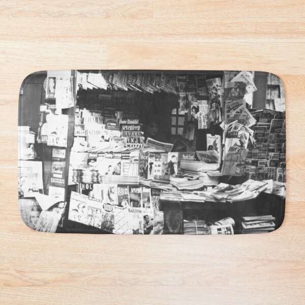 Item preview, Woman reading inside a New York City newsstand black and white street life photograph designed and sold by Astrid Arkhangelsky.