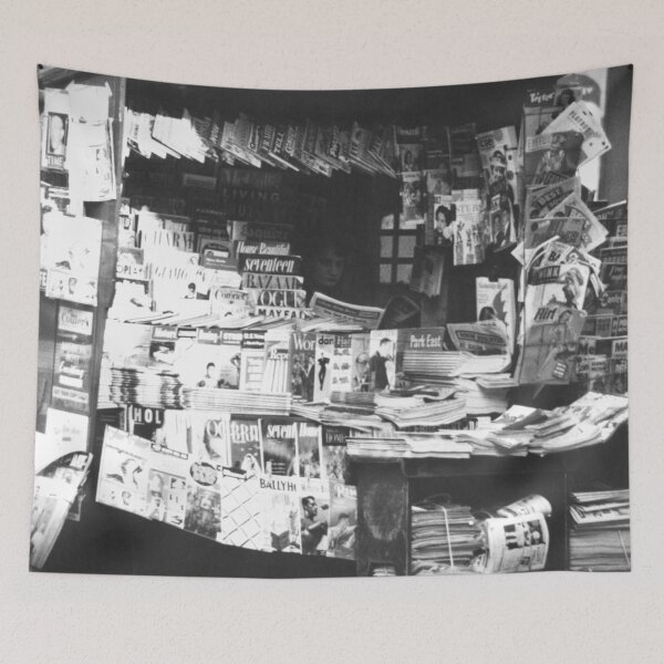 Item preview, Woman reading inside a New York City newsstand black and white street life photograph designed and sold by Astrid Arkhangelsky.