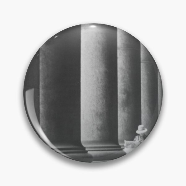Item preview, Woman reading newspaper while seated beside building columns black and white vintage art print photograph designed and sold by Astrid Arkhangelsky.