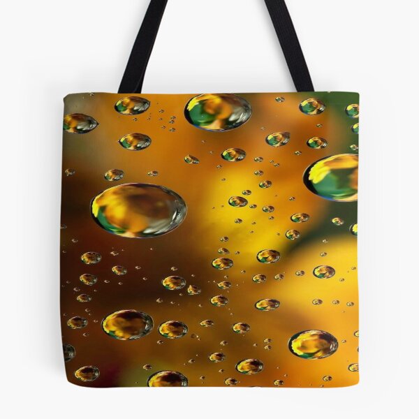 Item preview, The Radiance of Light Drops, Golden Water Drops with Colored Reflections - Abstract Macro Photography designed and sold by RAYBIL.