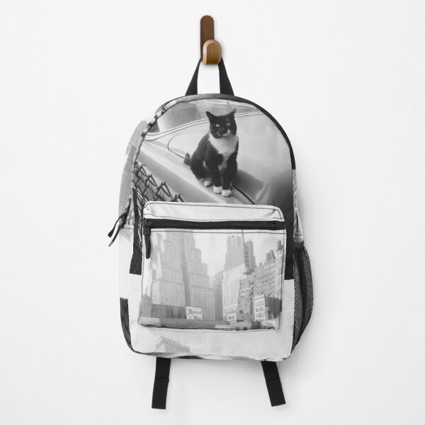 Item preview, Cats of New York, Cat sitting on car with skyscrapers in the distance vintage black and white photographic art print designed and sold by Astrid Arkhangelsky.