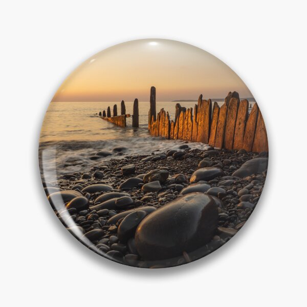 Item preview, Sunset lit beach groynes  designed and sold by twymanphoto.