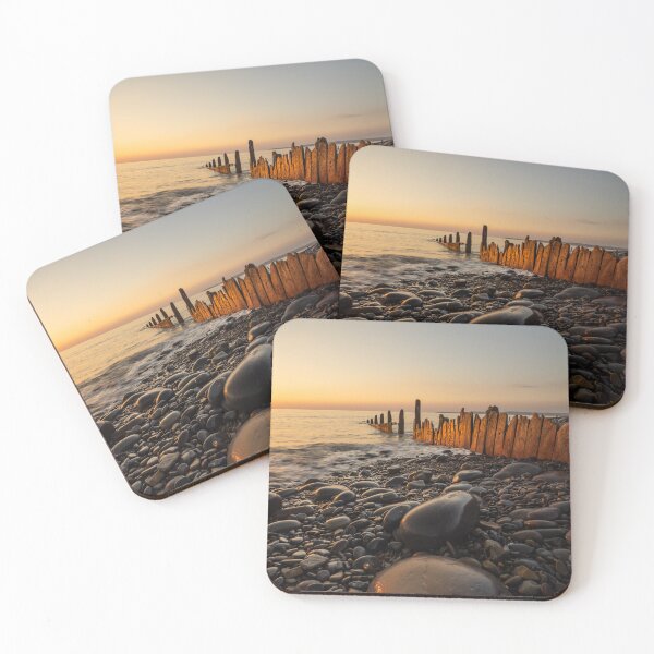 Item preview, Sunset lit beach groynes  designed and sold by twymanphoto.