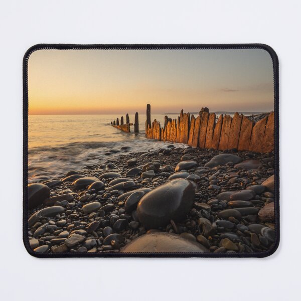 Item preview, Sunset lit beach groynes designed and sold by twymanphoto.