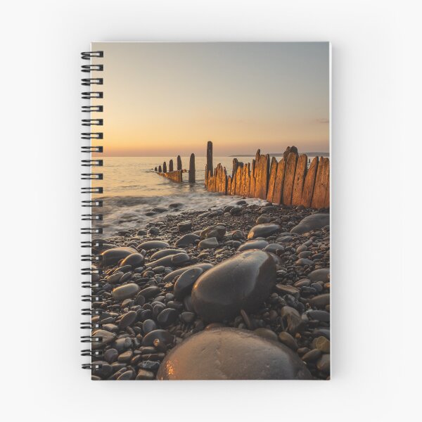 Item preview, Sunset lit beach groynes  designed and sold by twymanphoto.