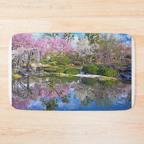 Item preview, Blossoming trees are reflected in the water, Setagaya Park in Vienna, springtime designed and sold by goceris.
