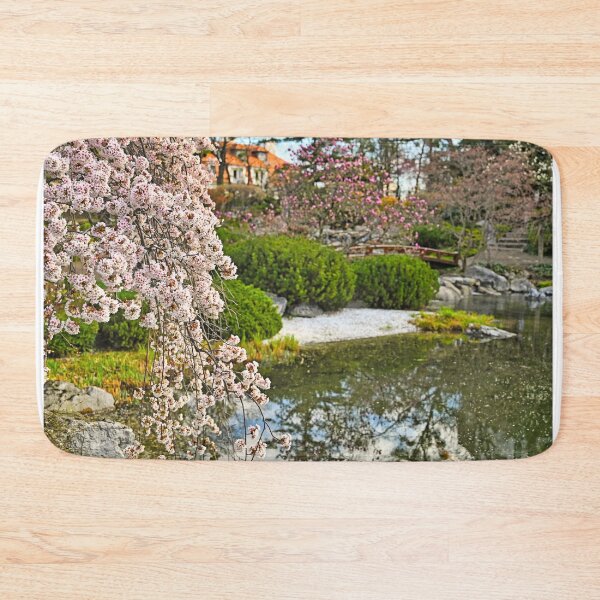 Item preview, Blossoming tree and pond in Setagaya Park in Vienna at springtime designed and sold by goceris.