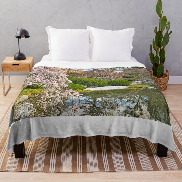 Item preview, Blossoming tree and pond in Setagaya Park in Vienna at springtime designed and sold by goceris.