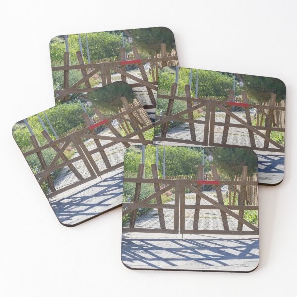 Item preview, Rustic Wooden Gate And Garden Fence Opening Onto Sunlit Path With Strong Shadow Patterns designed and sold by Nmallia.