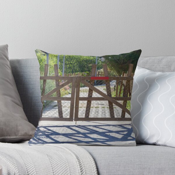 Item preview, Rustic Wooden Gate And Garden Fence Opening Onto Sunlit Path With Strong Shadow Patterns designed and sold by Nmallia.