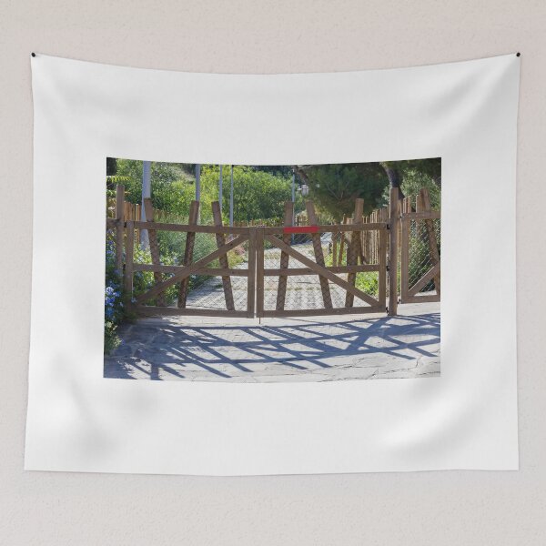 Item preview, Rustic Wooden Gate And Garden Fence Opening Onto Sunlit Path With Strong Shadow Patterns designed and sold by Nmallia.