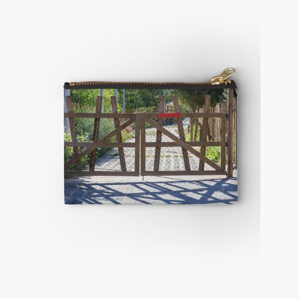 Item preview, Rustic Wooden Gate And Garden Fence Opening Onto Sunlit Path With Strong Shadow Patterns designed and sold by Nmallia.