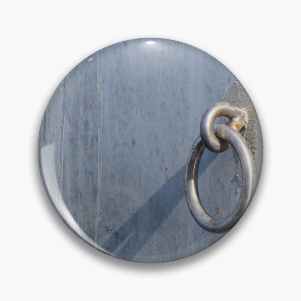 Item preview, Metal Ring Anchor Mounted On Weathered Gray Wall With Long Shadow, Industrial Hardware Detail designed and sold by Nmallia.