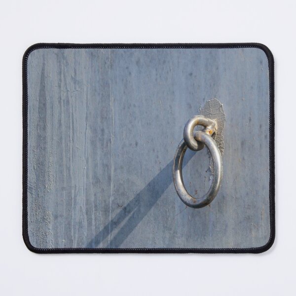 Item preview, Metal Ring Anchor Mounted On Weathered Gray Wall With Long Shadow, Industrial Hardware Detail designed and sold by Nmallia.