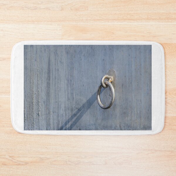 Item preview, Metal Ring Anchor Mounted On Weathered Gray Wall With Long Shadow, Industrial Hardware Detail designed and sold by Nmallia.